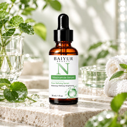Baiyur Beauty Niacinamide Serum displayed on a natural stone platform with fresh green leaves, glass accessories and soft sunlight.