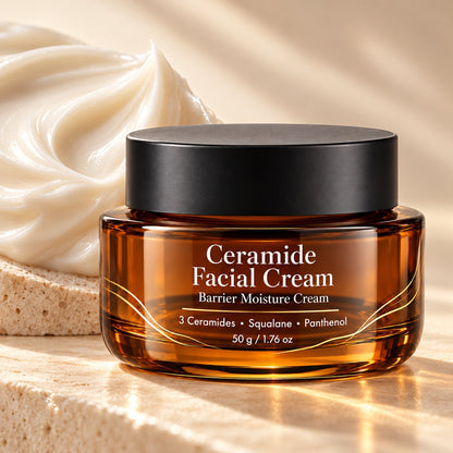 Luxury Ceramide Facial Cream in an amber glass jar displayed with rich cream texture, natural beige stone and warm sunlight.