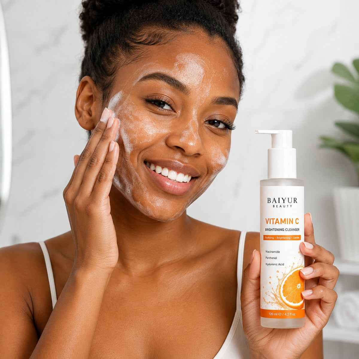 Black model applying Baiyur Beauty Vitamin C Brightening Facial Cleanser during daily face cleansing