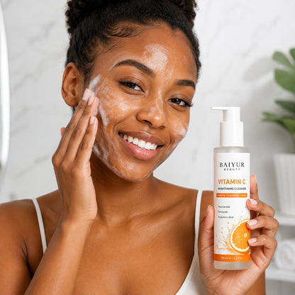Black model applying Baiyur Beauty Vitamin C Brightening Facial Cleanser during daily face cleansing